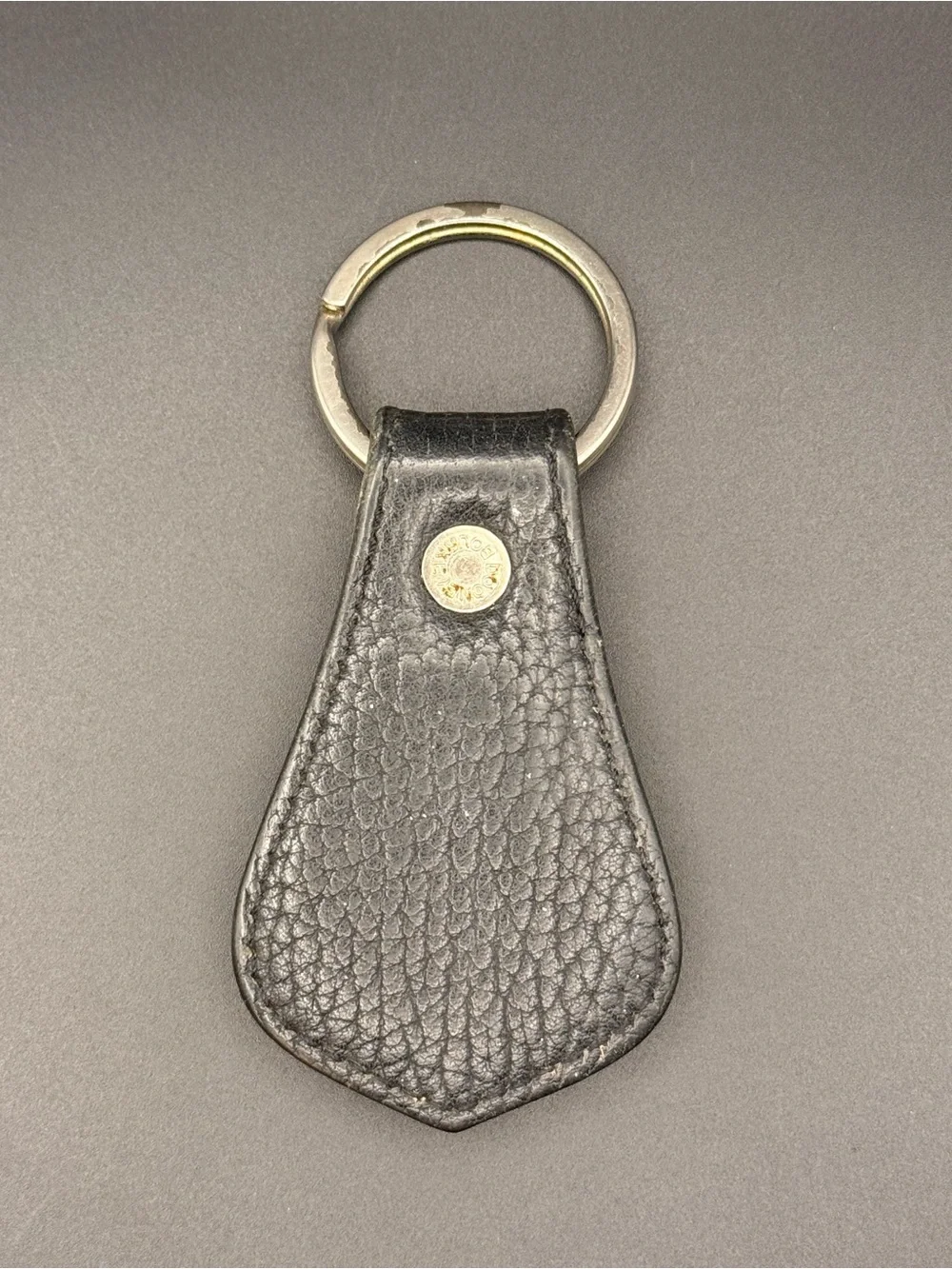 Dooney and Bourke Vintage Black and Tan Leather Keychain with Brass Medallion